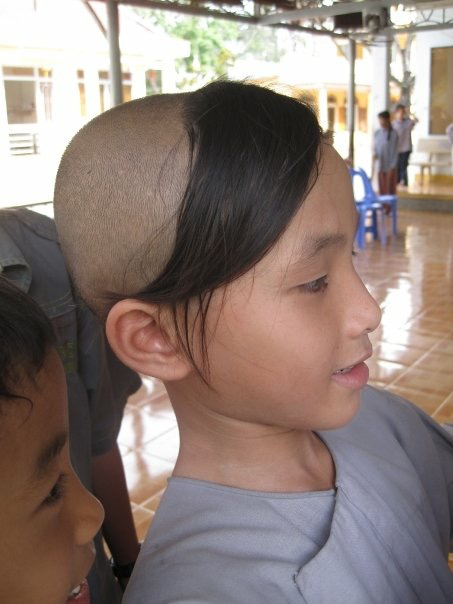 The orphans that choose to become monks have their heads shaved into three hair patches. As they graduate different study levels, the hair patches are shaved from 3 to 2, to 1, to bare.